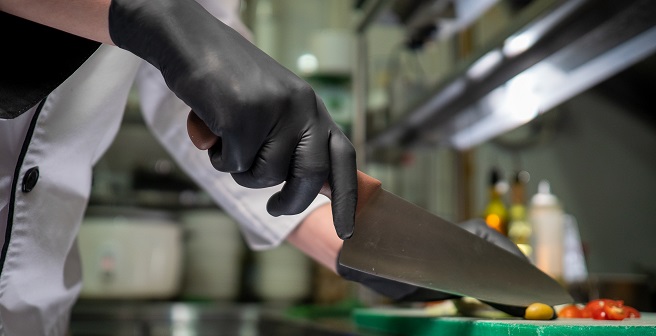 Using food handling certified glove on food preparation